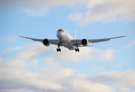 Airline - white passenger plane in mid air during daytime