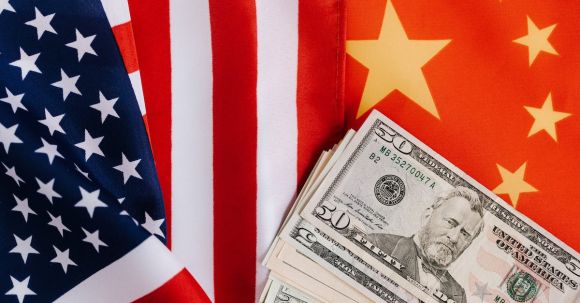 Usa Vs China - American and Chinese flags and USA dollars